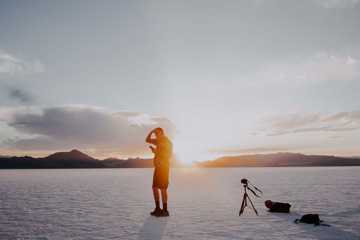 united states man standing on ice field beach